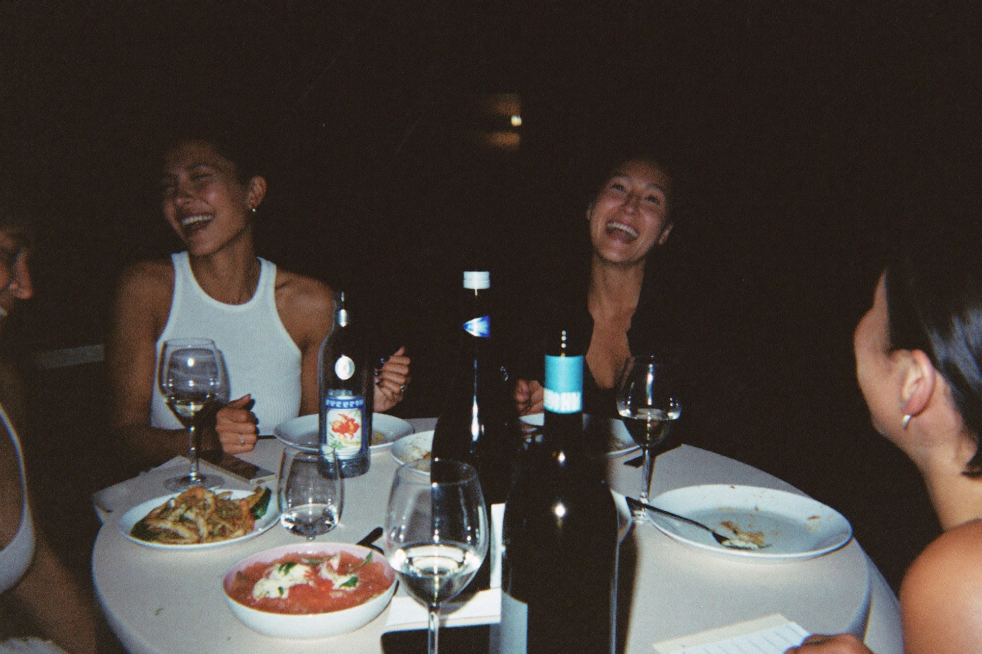 Friends in a grainy flash. Atmosphere only — not a guest frame.